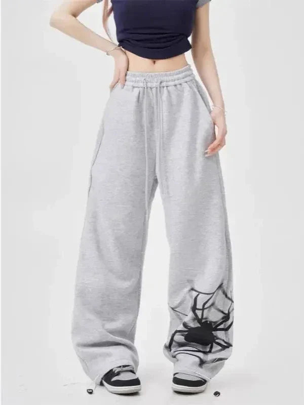 Model wearing the gray Y2K Graphic Wide-Leg Sweatpants