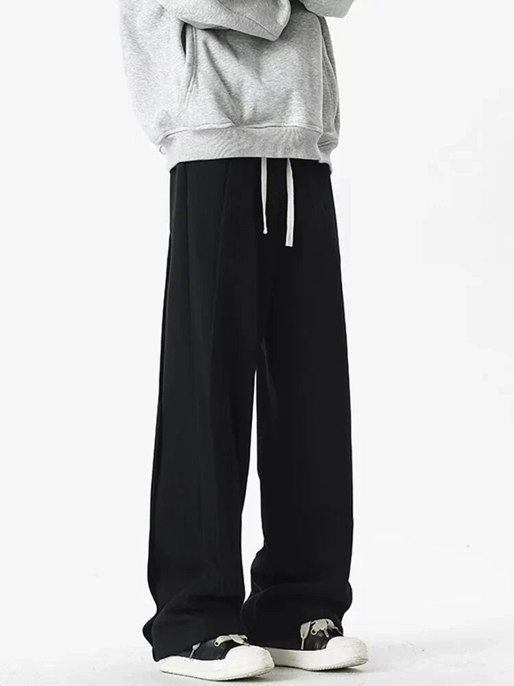 Front view of the black Loose Fit Pleated Sweatpants